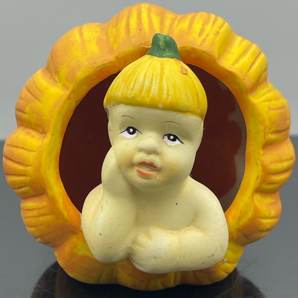 K's Collection Ceramic Fall Decoration: Cut Out Pumpkin with Baby Laying Inside